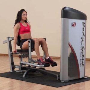 Adducteurs et Abducteurs BODYSOLID Professionnel. On voit une femme en pleine utilisation